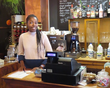 a woman working in a cafe