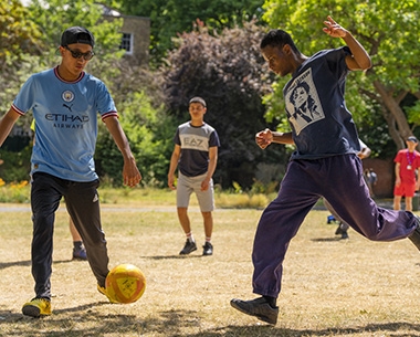 young men playing football